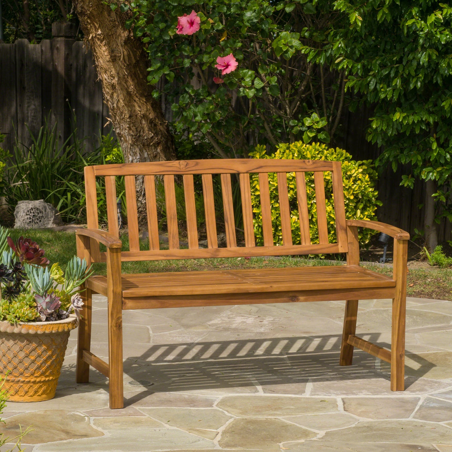 Solid wood garden bench with slatted seat and back perfect for outdoor relaxation