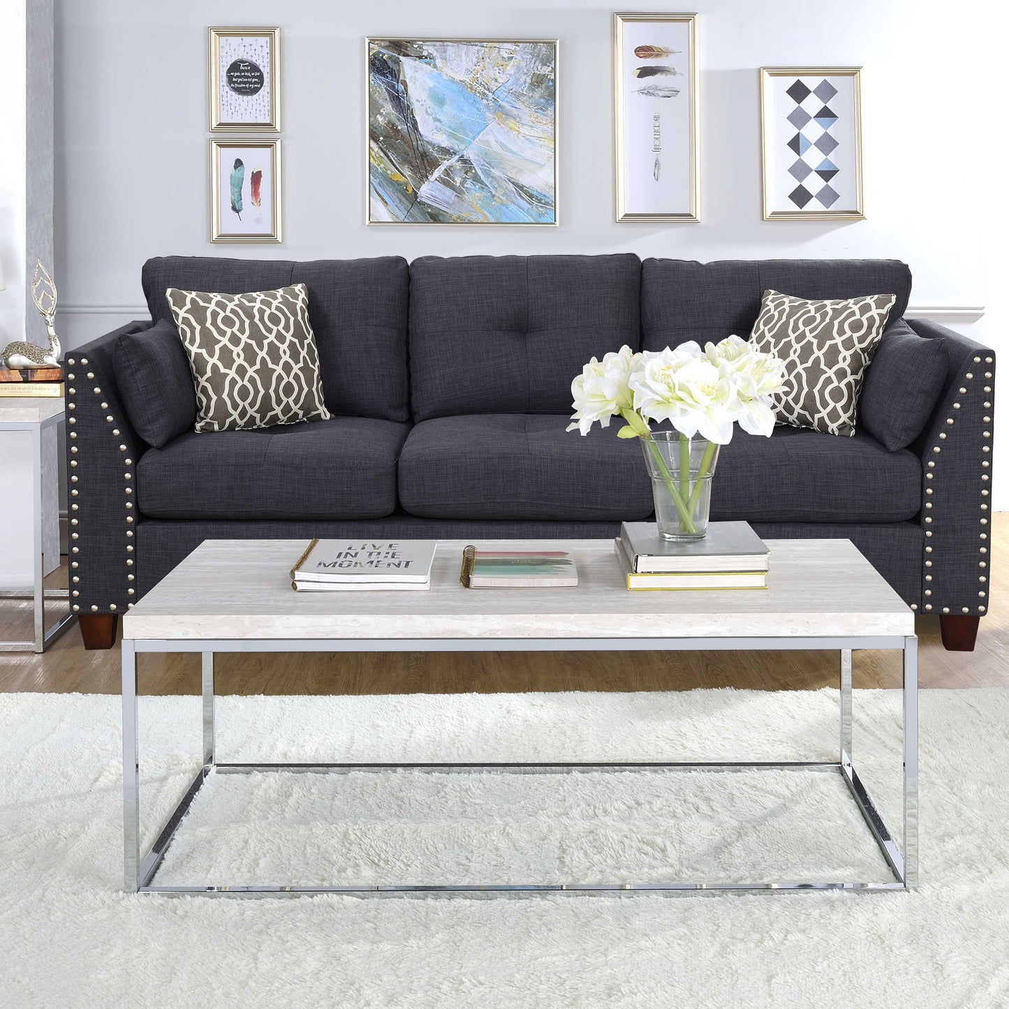 Dark gray linenlook sofa with tufted back and decorative nailhead trim