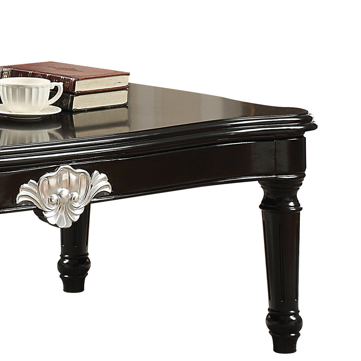 Elegant dark wood coffee table with ornate silver drawer pull detail