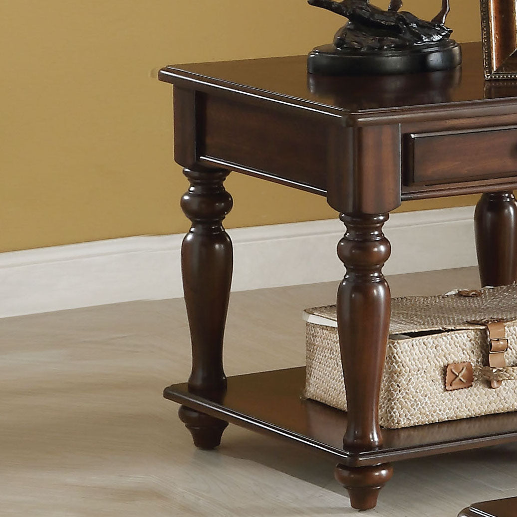 Ornate dark wood end table with drawer and turned legs