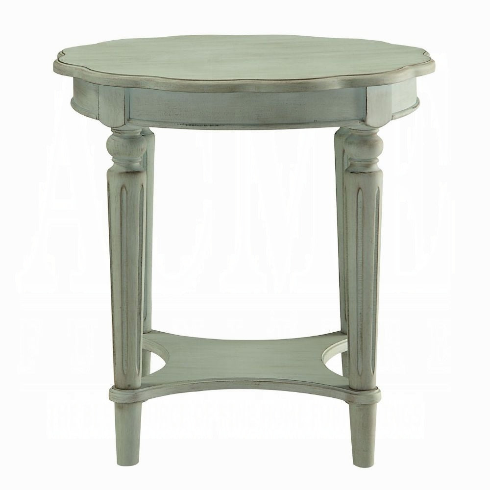 Distressed pale blue oval end table with carved legs