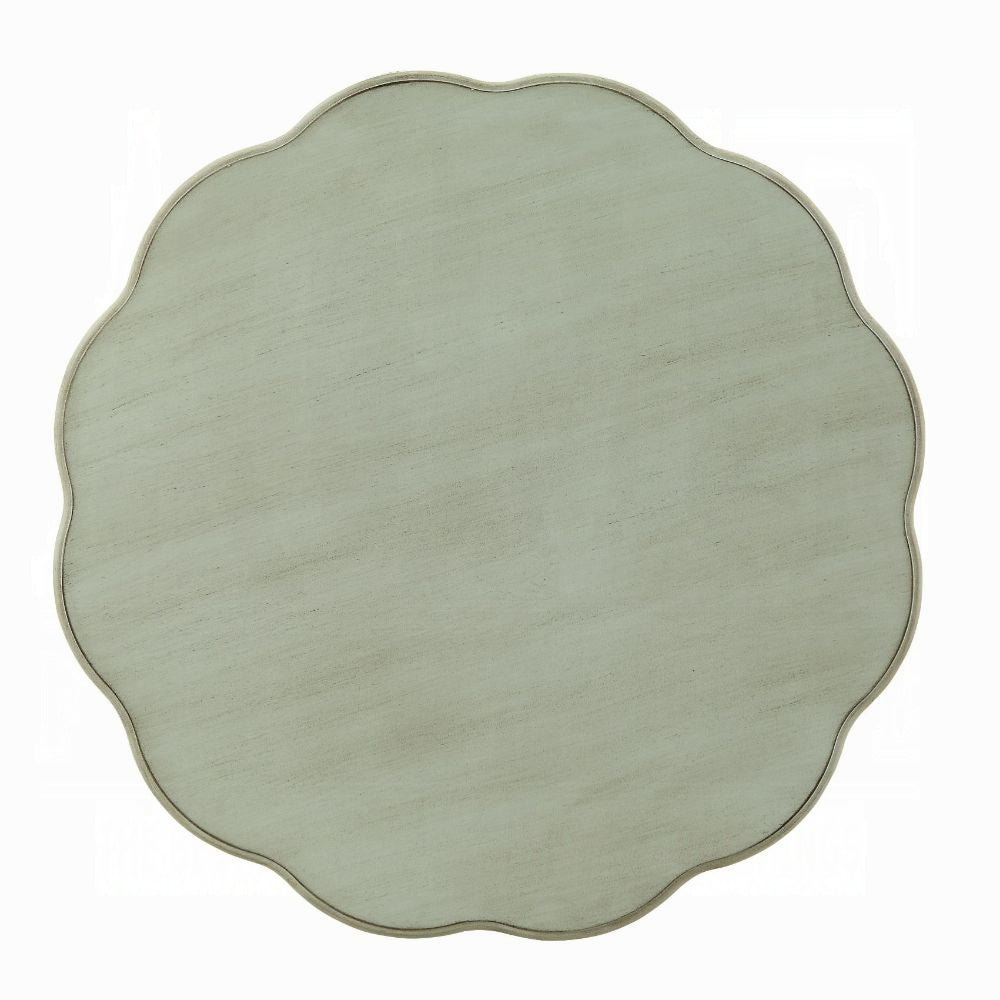 Distressed white scalloped side table with a subtle wood grain texture perfect for French country decor