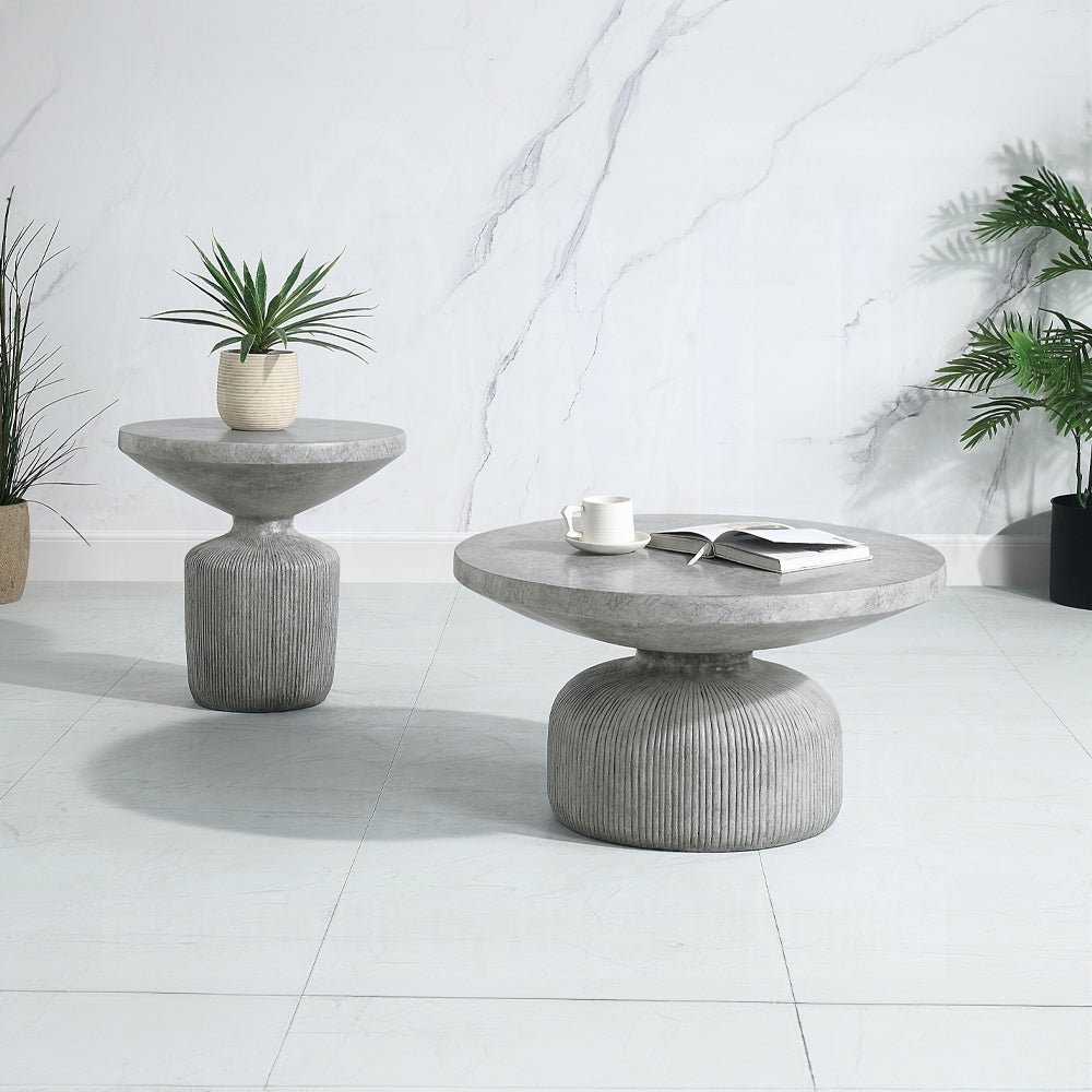 Modern grey concrete side table with ribbed base and plant