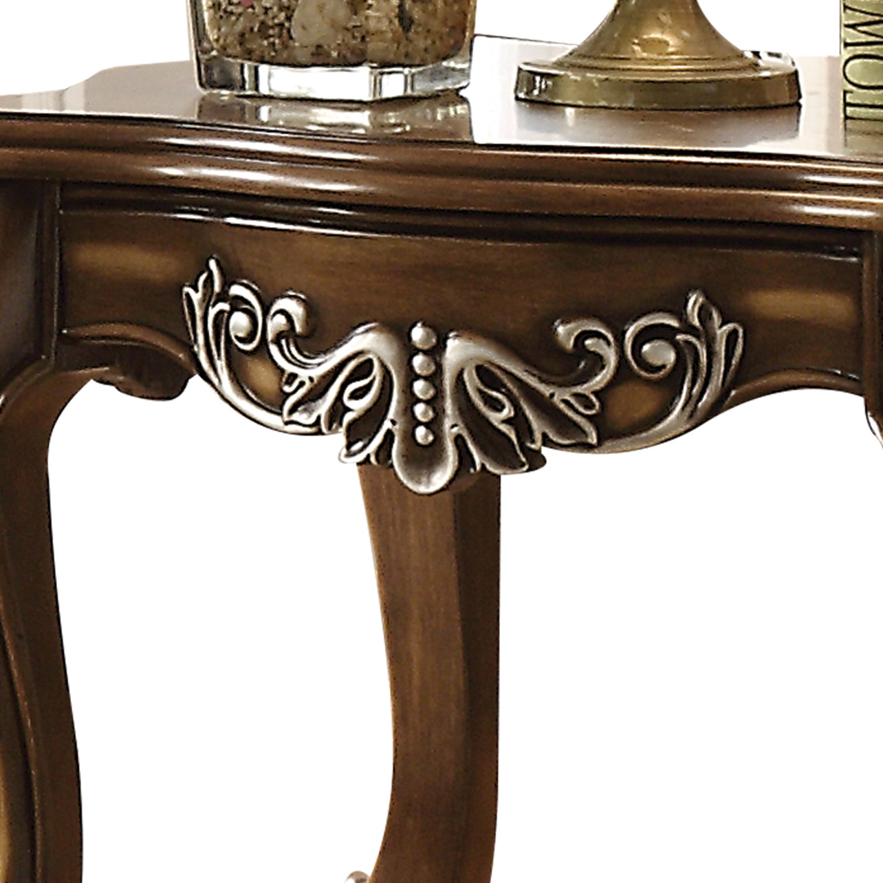 Ornate carved wood side table with silver accent detailing