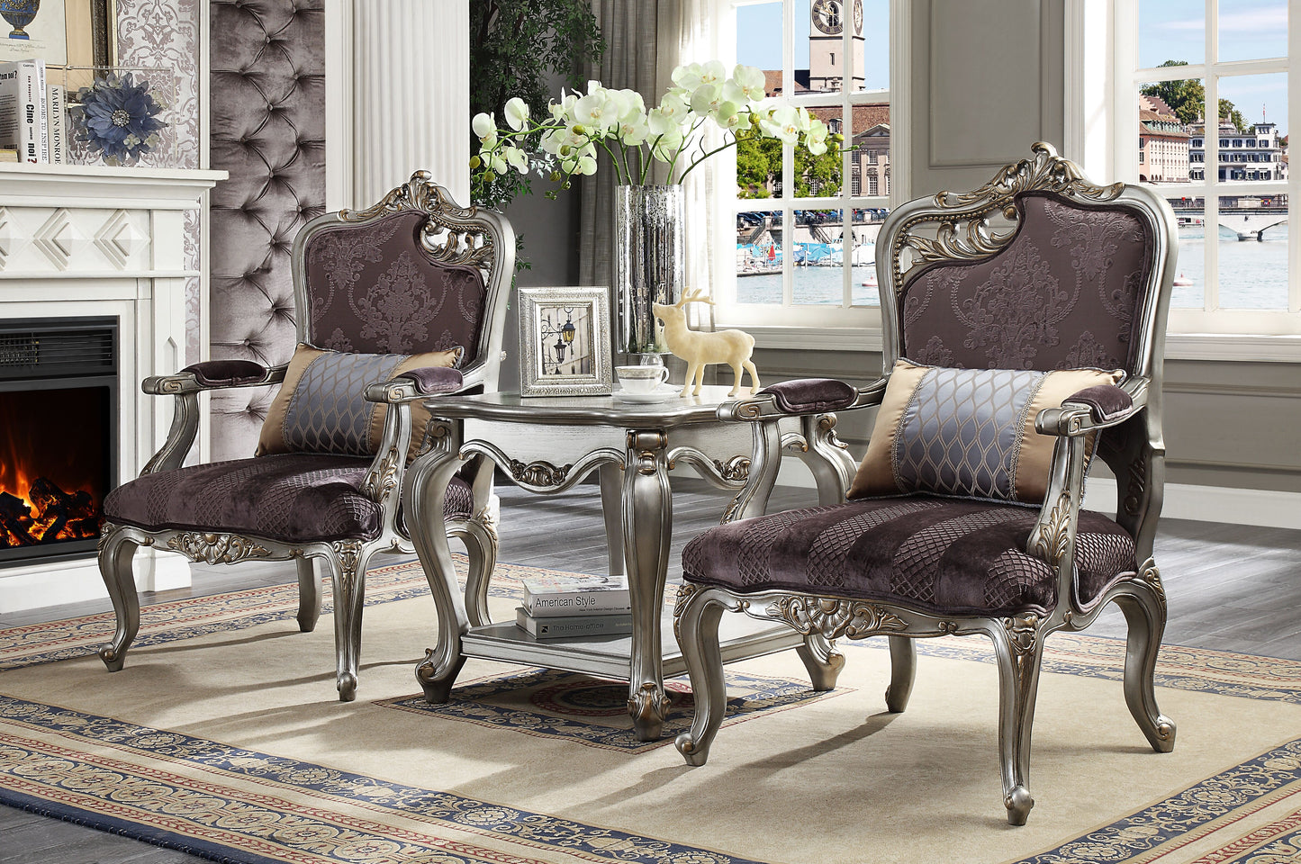 Ornate baroque armchair in deep purple with silver trim and decorative pillows