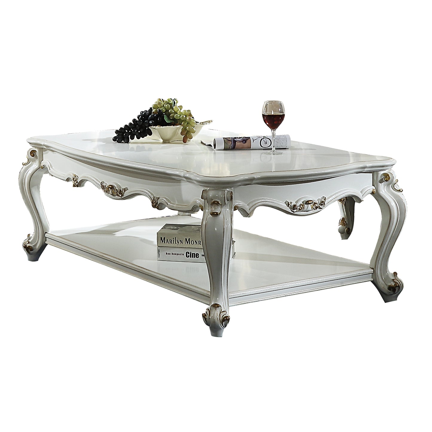 Elegant white ornate coffee table with gold accents and lower shelf