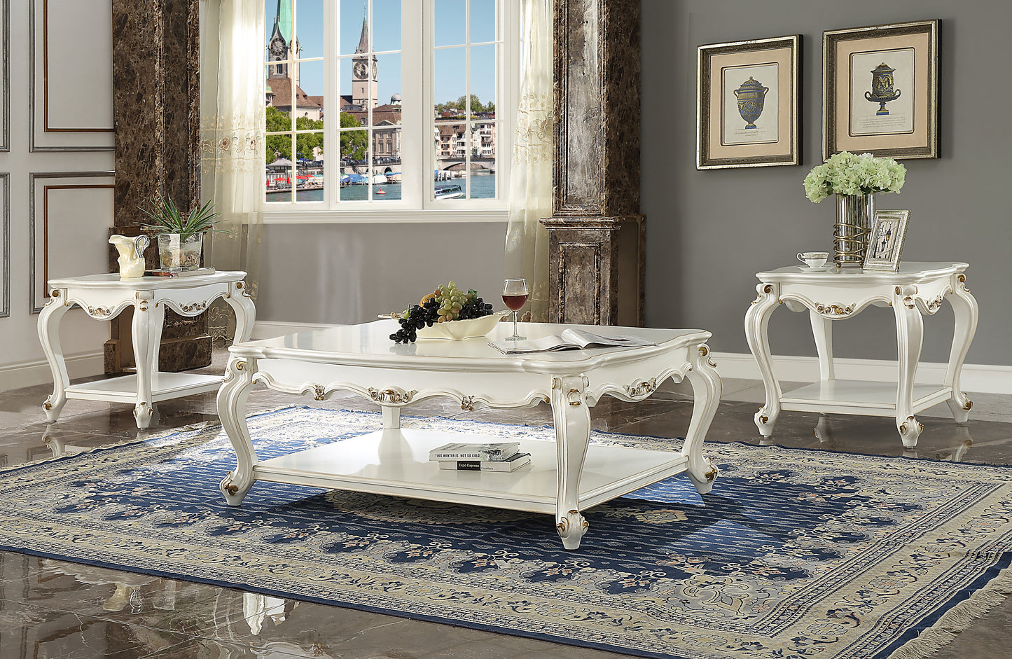 White ornate coffee table with gold accents and decorative legs