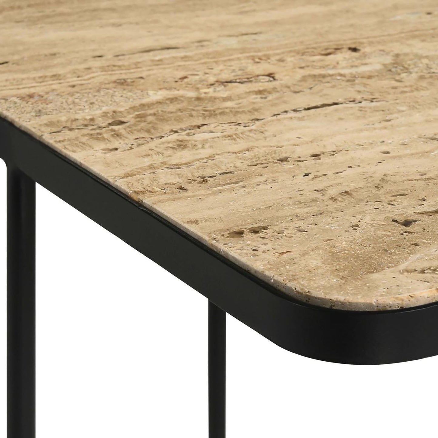 Closeup of a travertine marble table top with a black metal frame