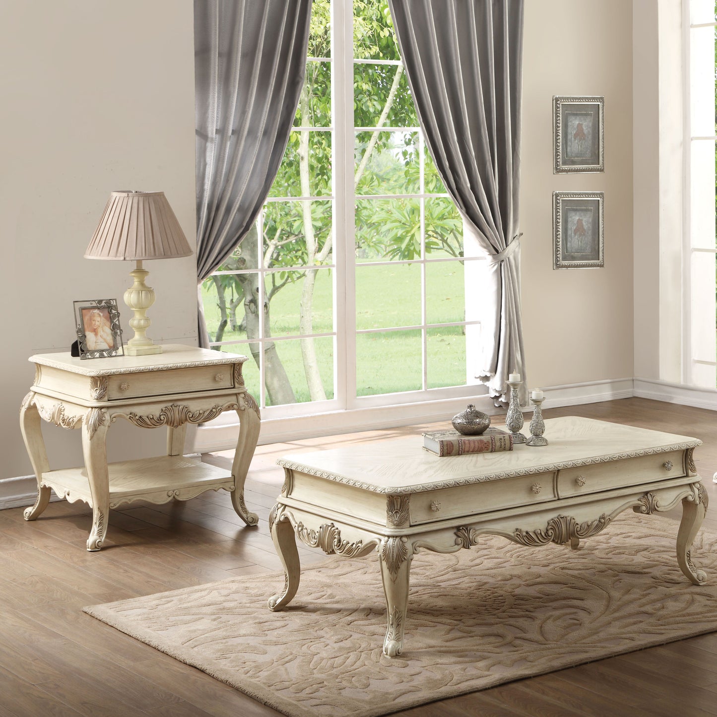 Antique cream coffee table with ornate carvings and brass knobs perfect for living rooms