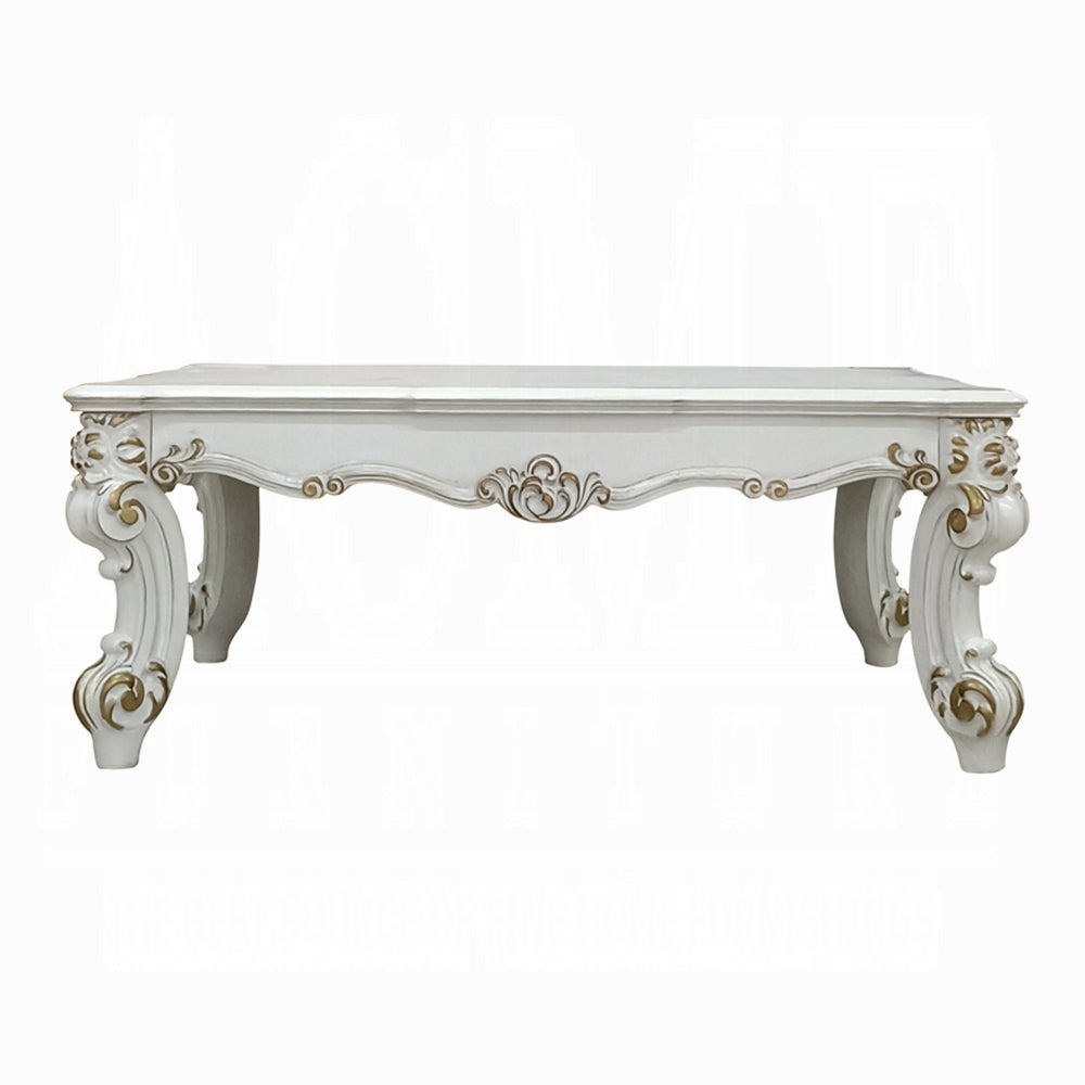 Ornate white carved coffee table with gold accents a classic centerpiece for living rooms