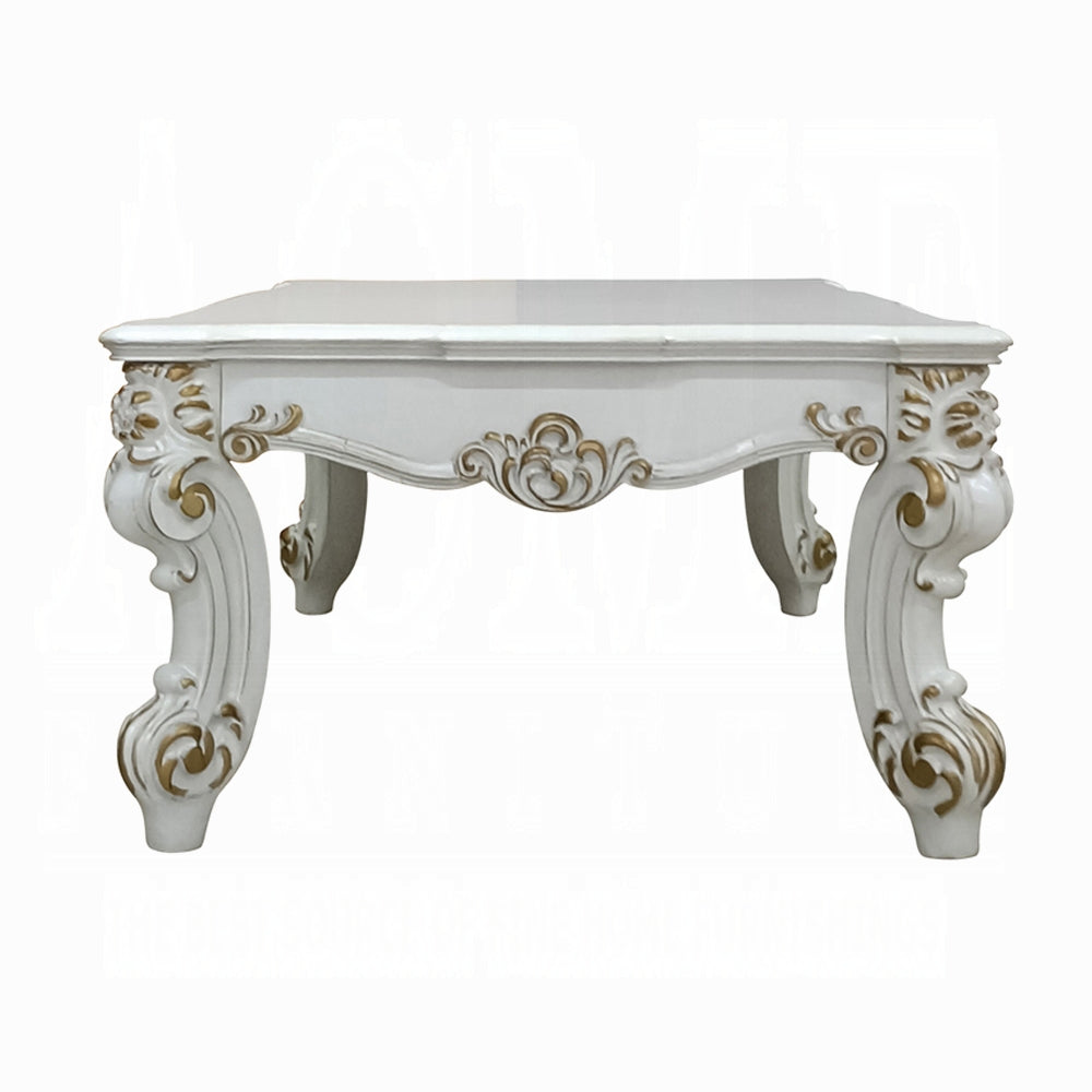 Ornate white baroque coffee table with gold accents on curved legs
