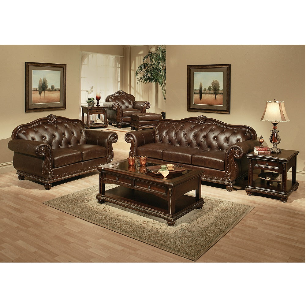 Brown tufted leather sofa set with ornate carved wood trim and decorative nailhead accents for a luxurious living room