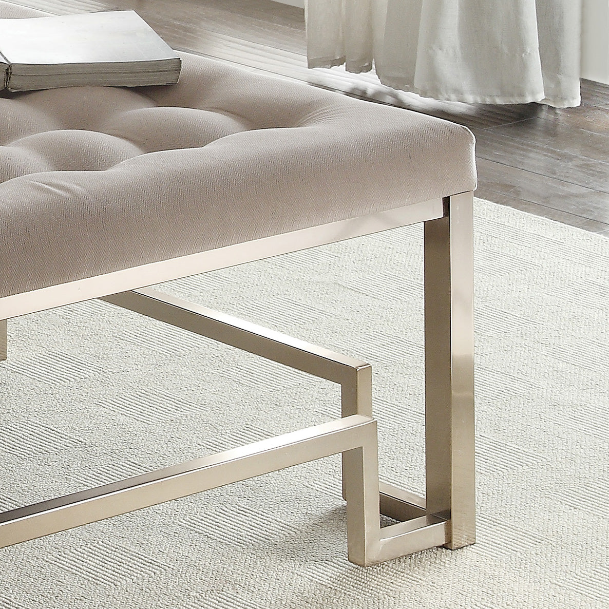 Tufted beige fabric ottoman with modern metallic legs perfect accent seating