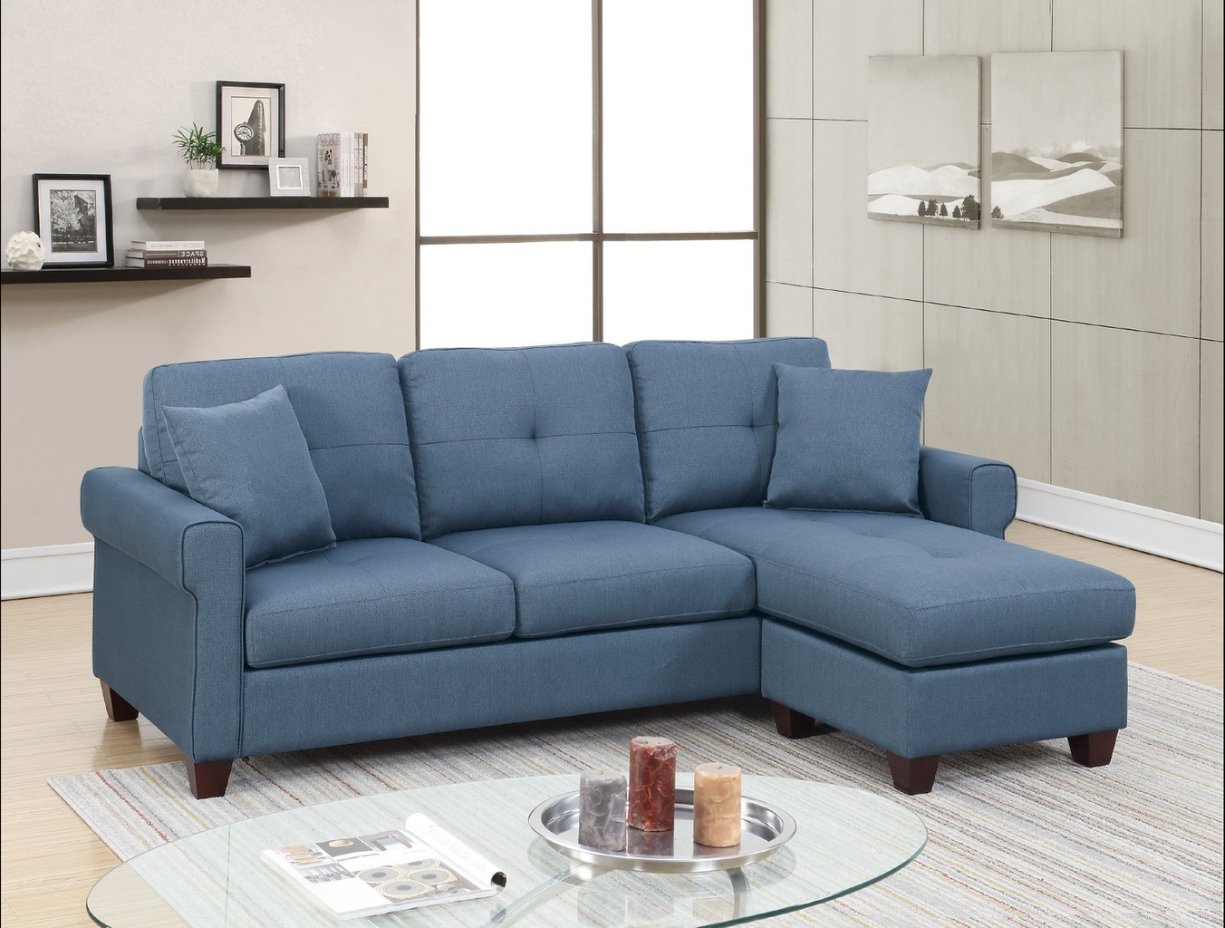Blue fabric sectional sofa with tufted cushions and rolled arms