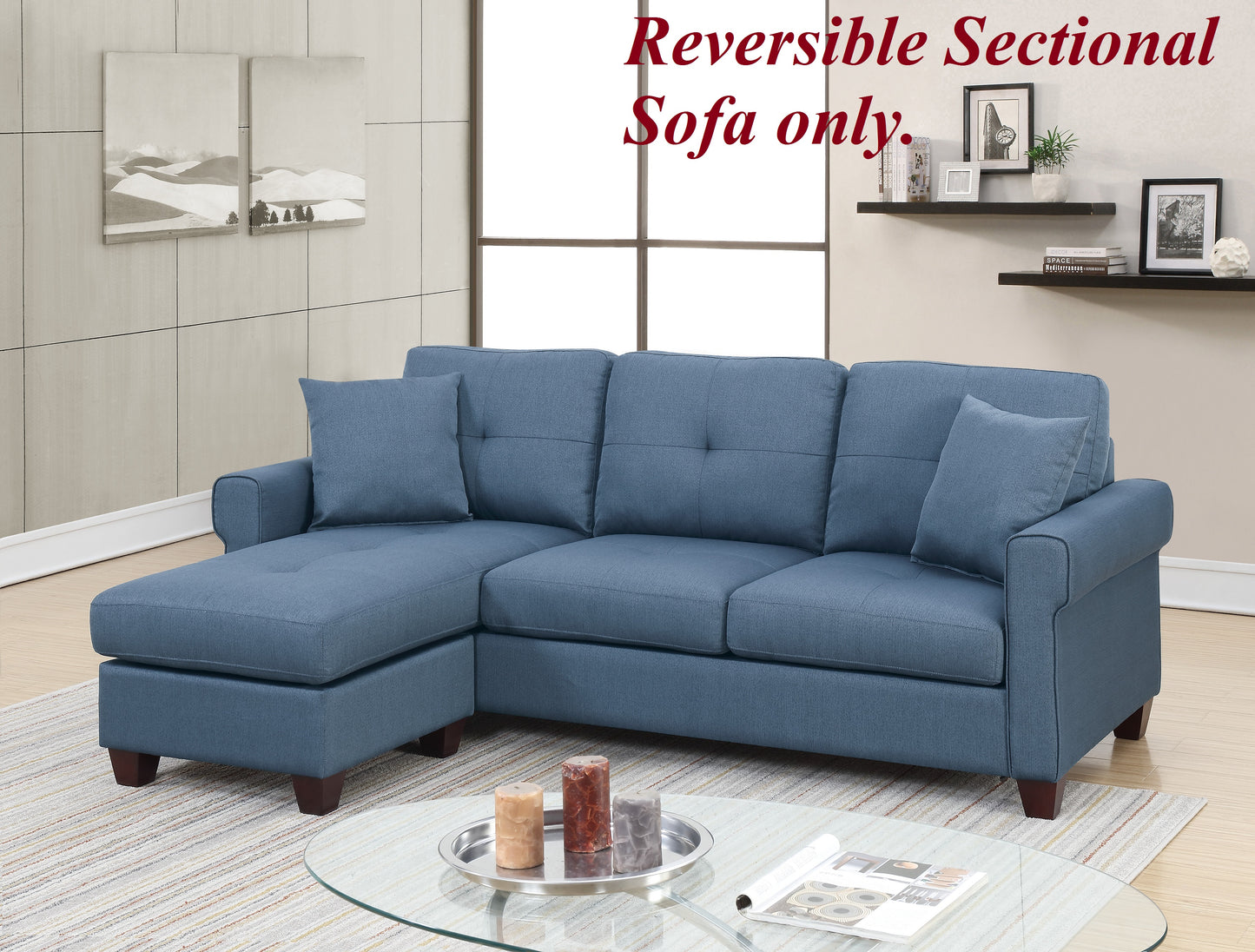 Blue fabric reversible sectional sofa with tufted cushions and chaise