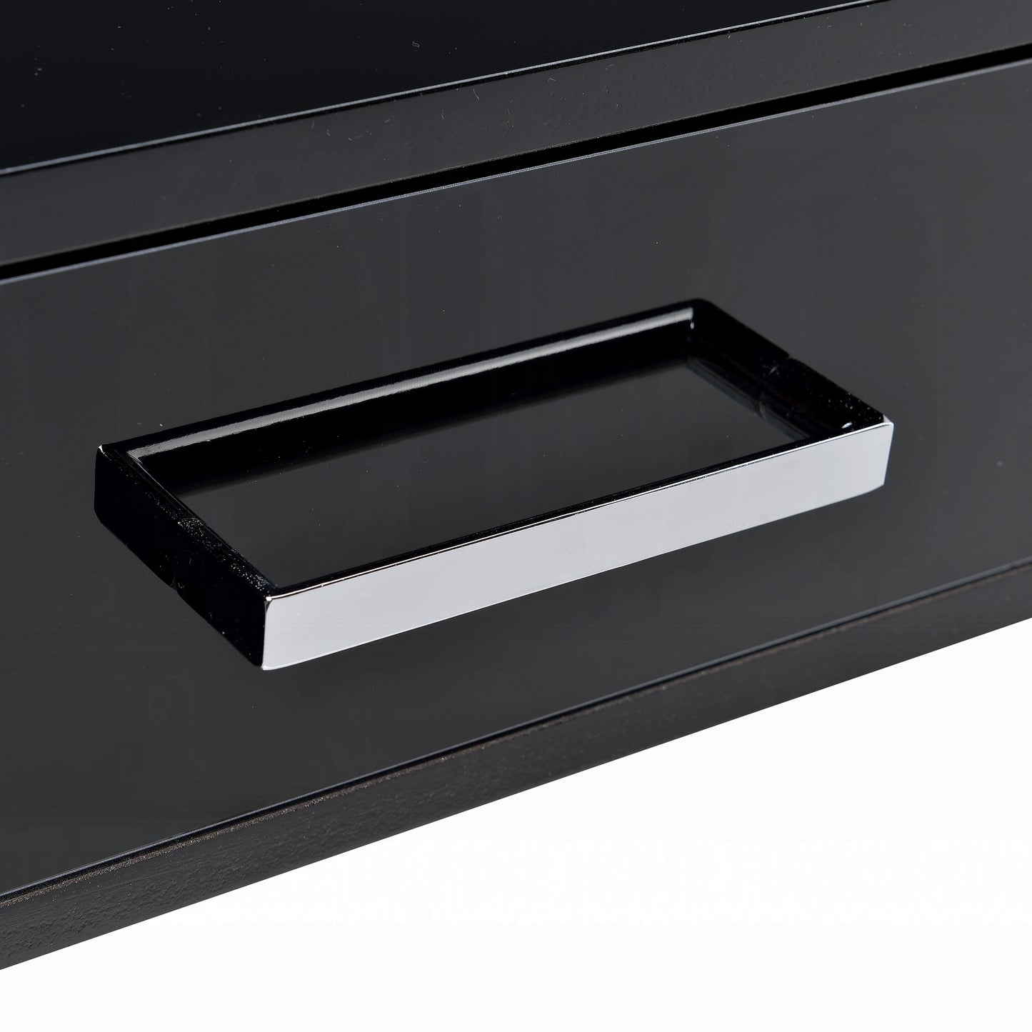 Sleek black dresser drawer with a polished chrome handle modern design