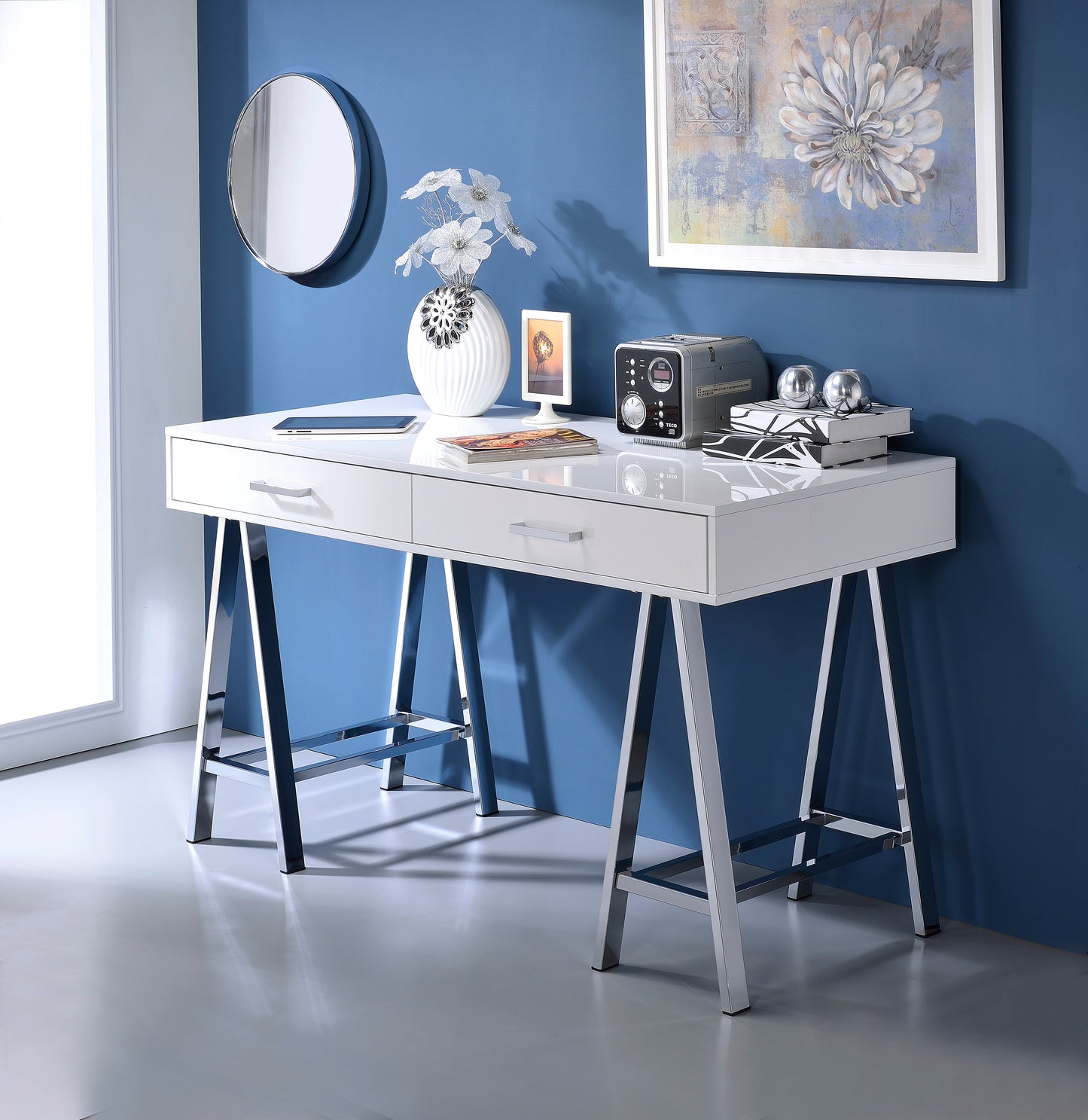 Sleek white modern desk with chrome Aframe legs two drawers and a slim tablet