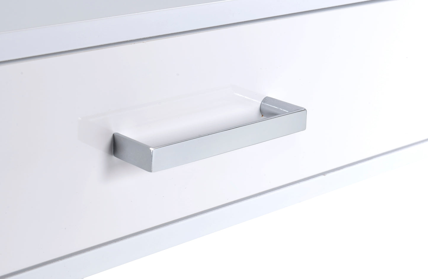 Modern silver drawer handle on a glossy white cabinet surface for sleek cabinetry hardware