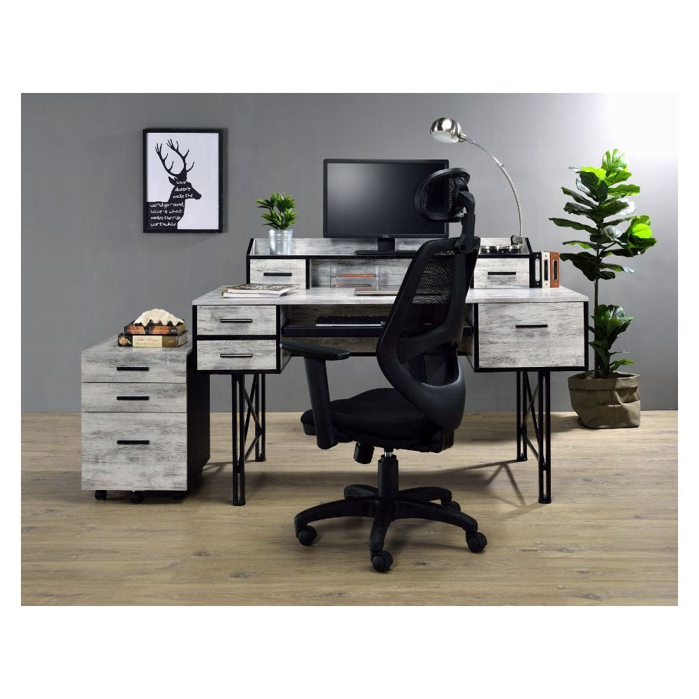 Modern white washed wood desk with black metal legs and ergonomic office chair