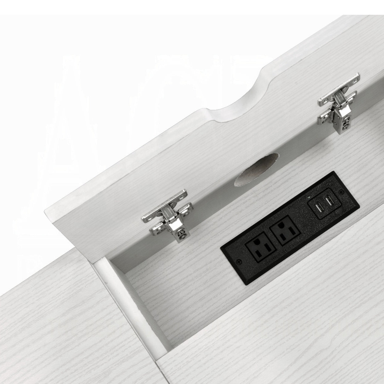 Closeup of integrated desk power outlet with dual USB ports and outlets