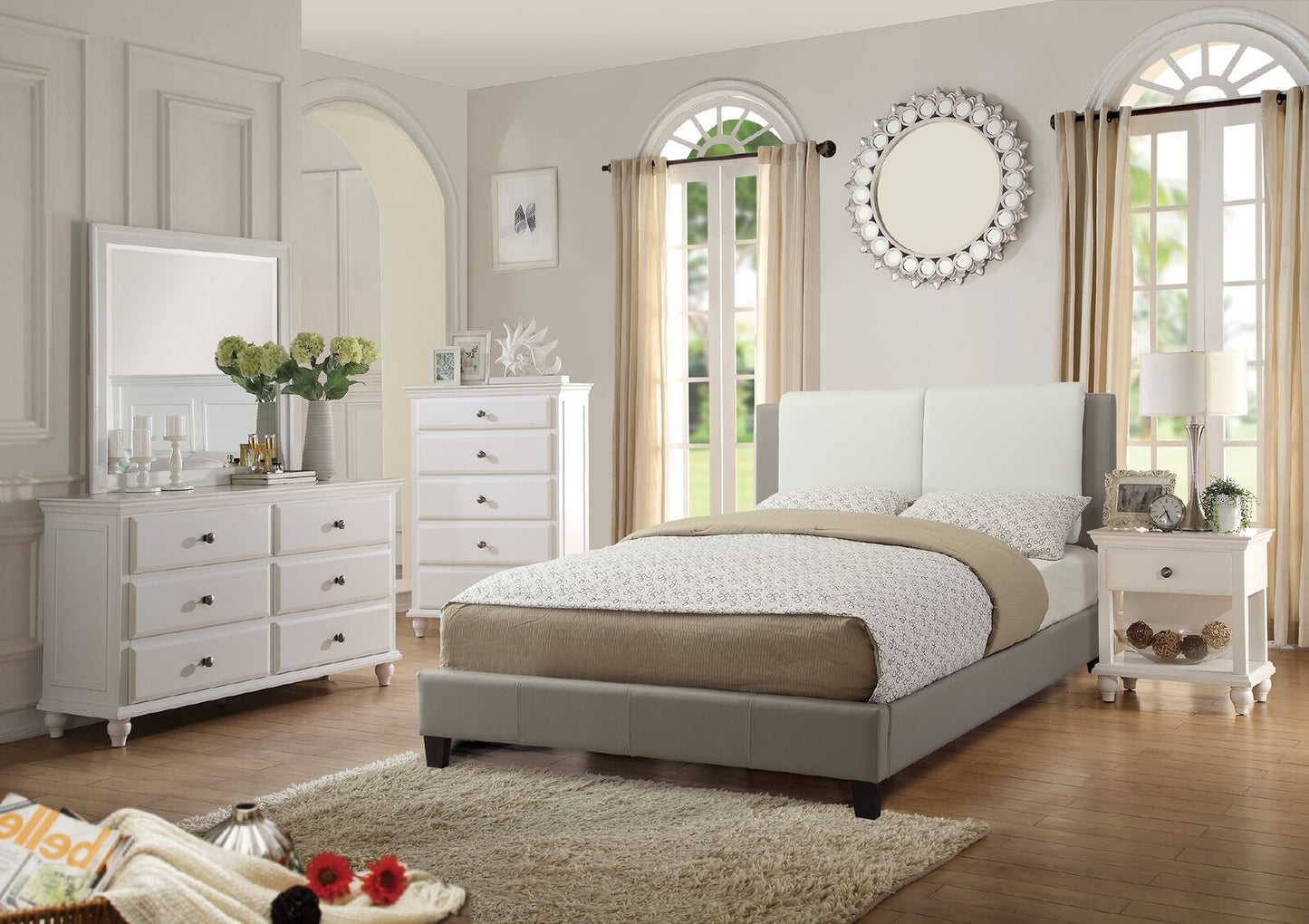 Grey and white upholstered queen bed frame with decorative pillows complementing bedroom decor
