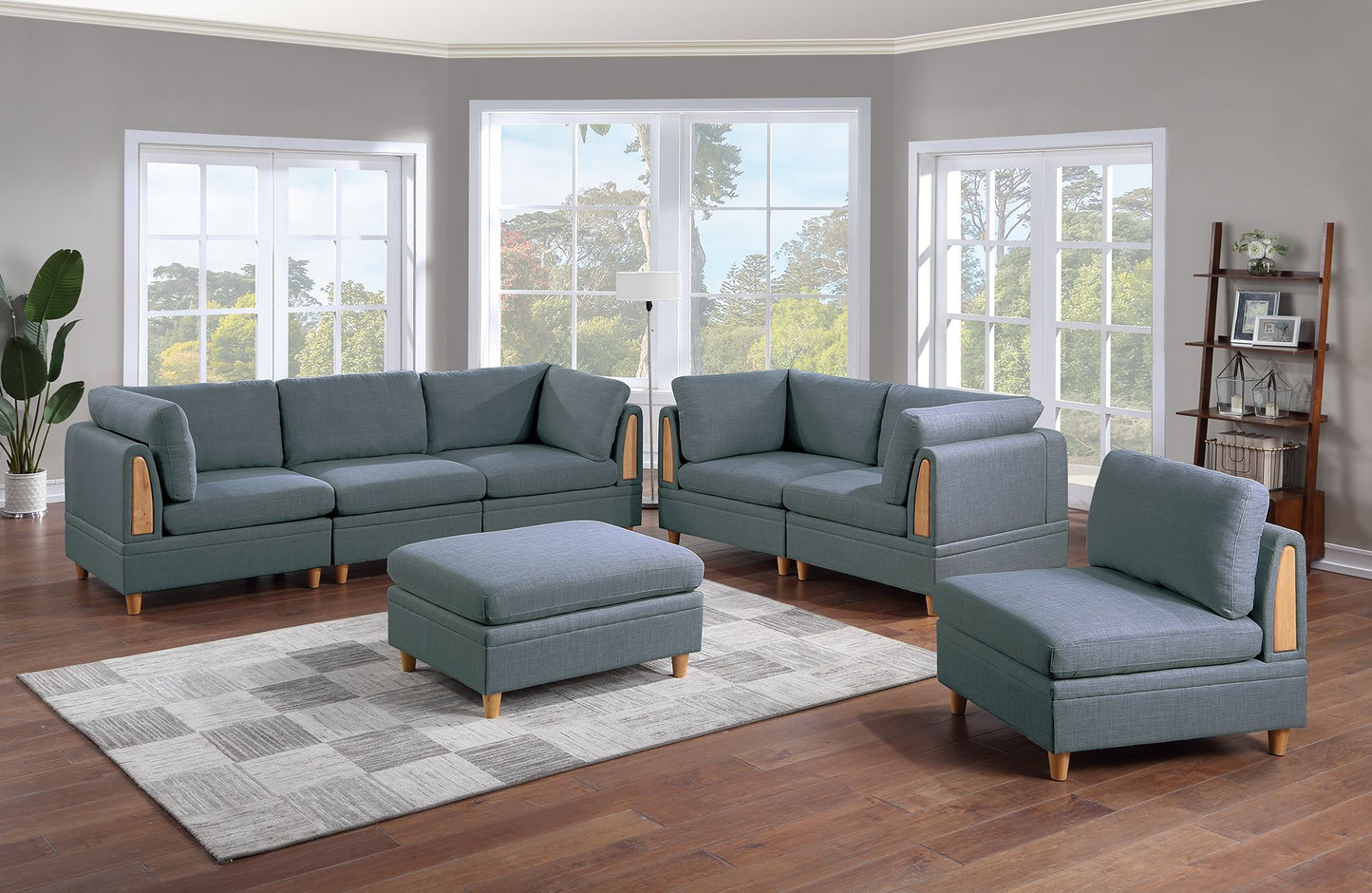 Gray fabric modular sectional sofa with wooden accents and matching ottoman on a checkered rug