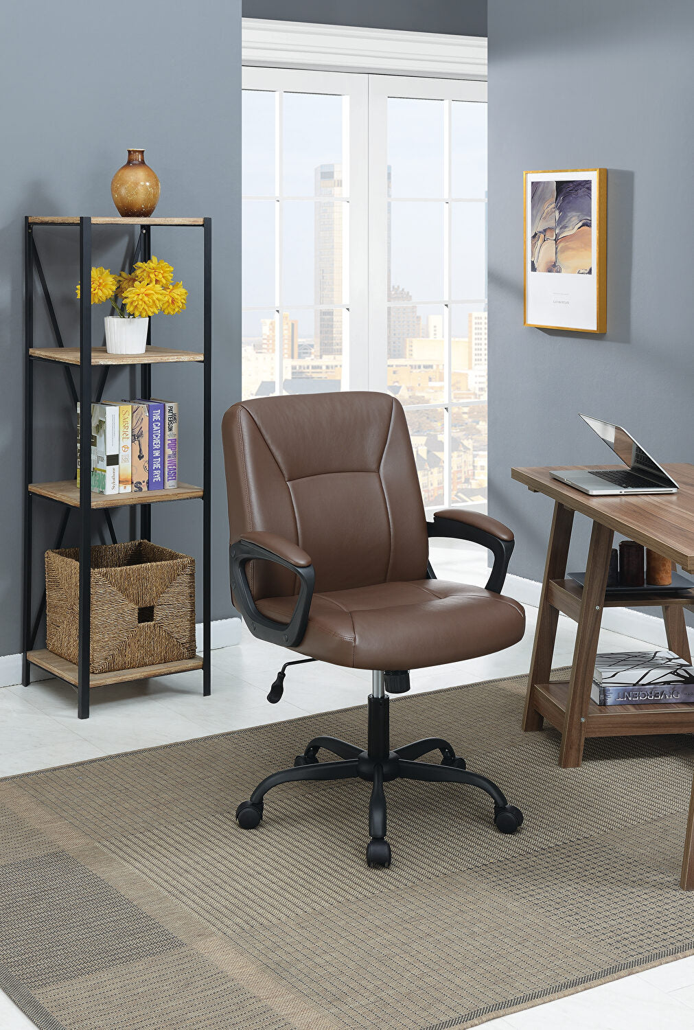 Brown faux leather office chair with black wheels and armrests