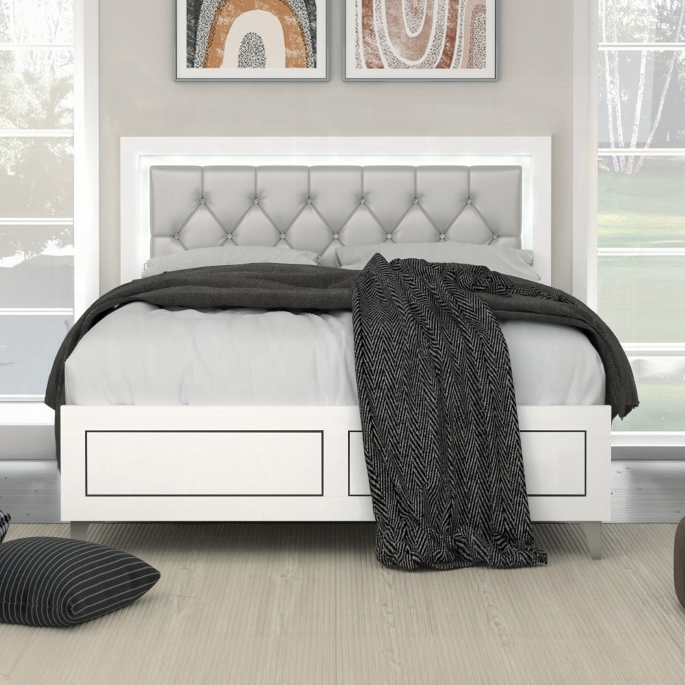 White upholstered platform bed with tufted headboard and builtin lighting