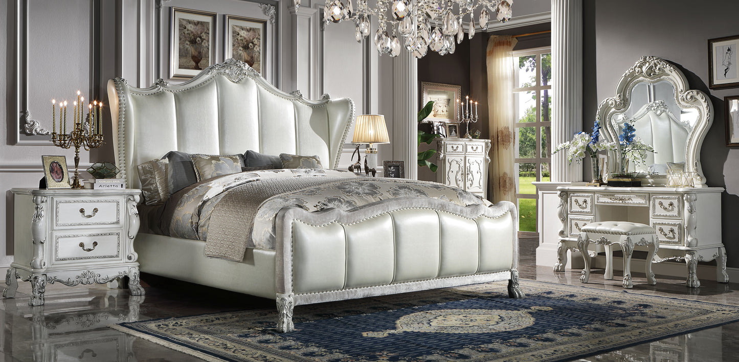 Ornate white upholstered king bed with crystal chandelier a luxurious bedroom centerpiece