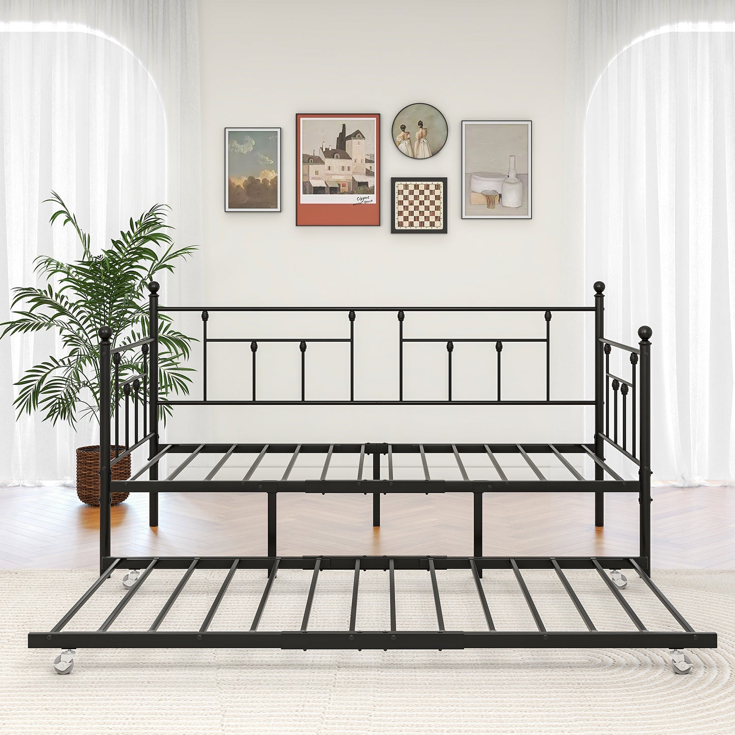 Black metal daybed with pullout trundle on wheels ideal for guest rooms