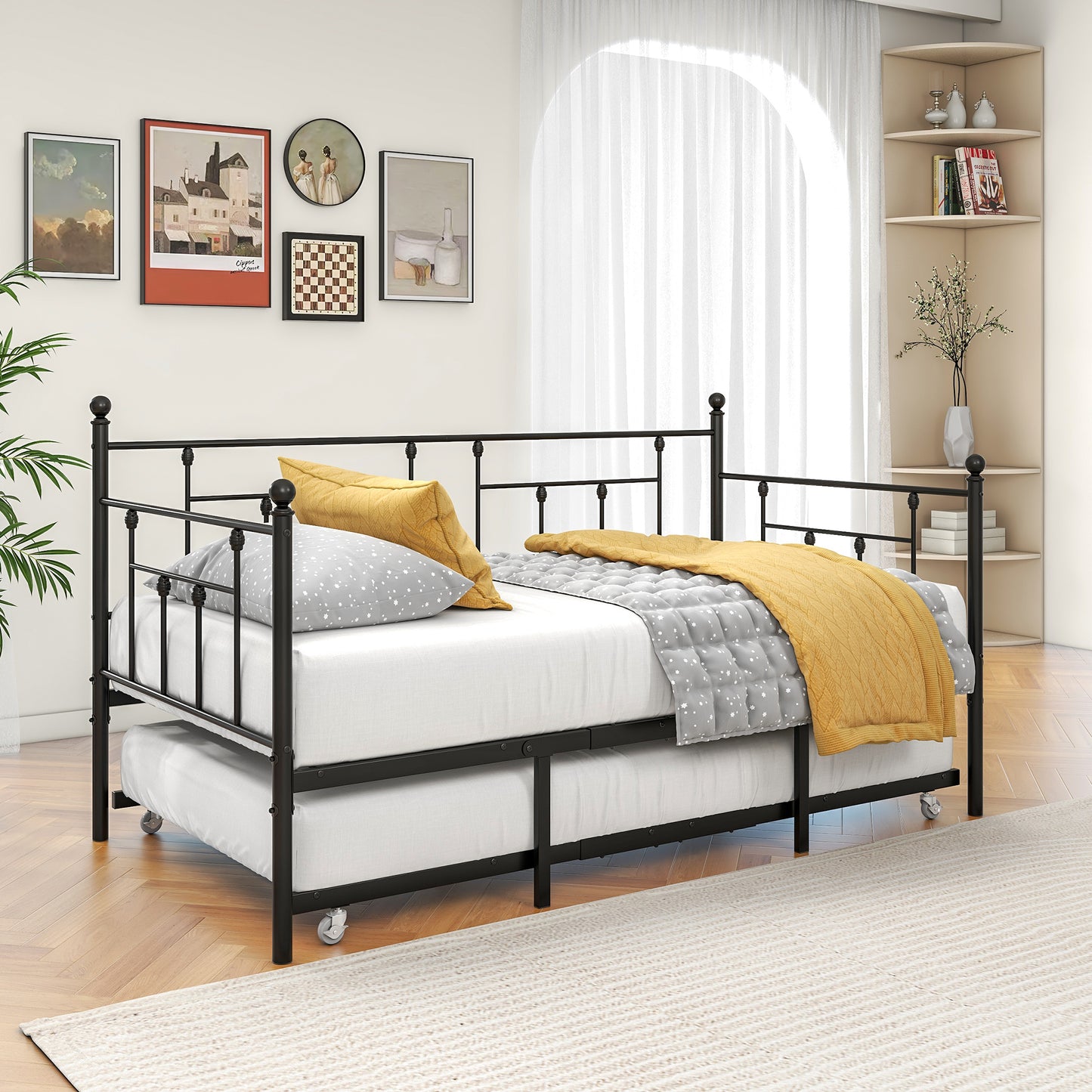 Black metal daybed with pullout trundle white mattress yellow and grey pillows
