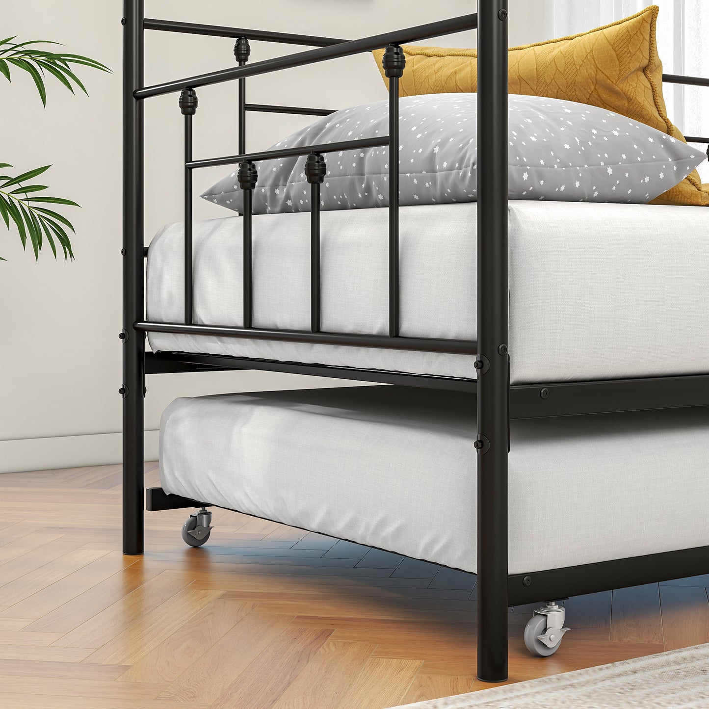 Black metal twin daybed with a pullout trundle bed for guest rooms