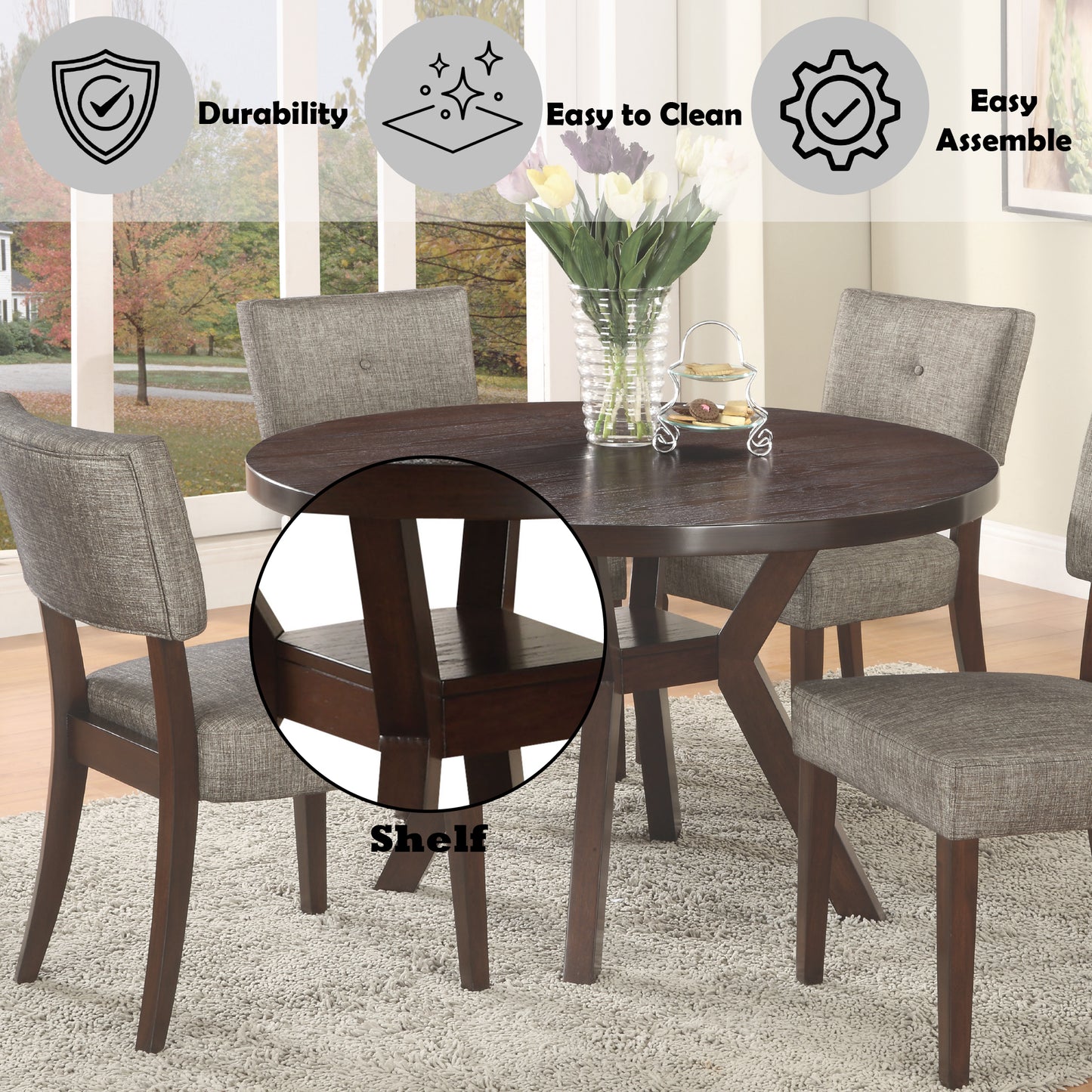 Round dining table with dark wood finish and four grey upholstered chairs
