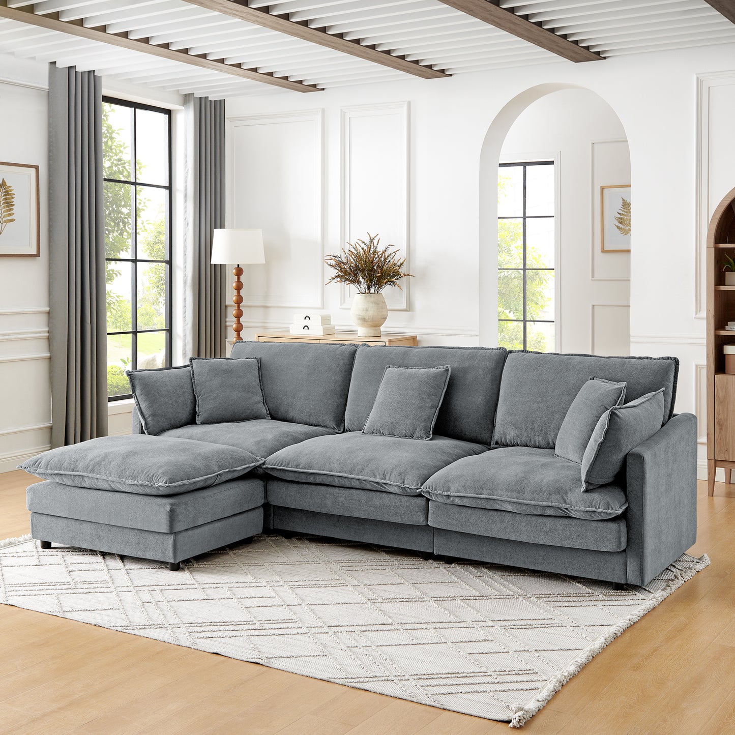 Plush grey sectional sofa with chaise and loose cushions perfect for living room comfort