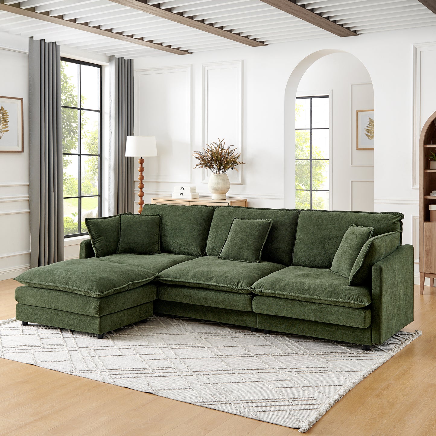 Plush green velvet sectional sofa with deep seats and plush cushions perfect for modern living rooms