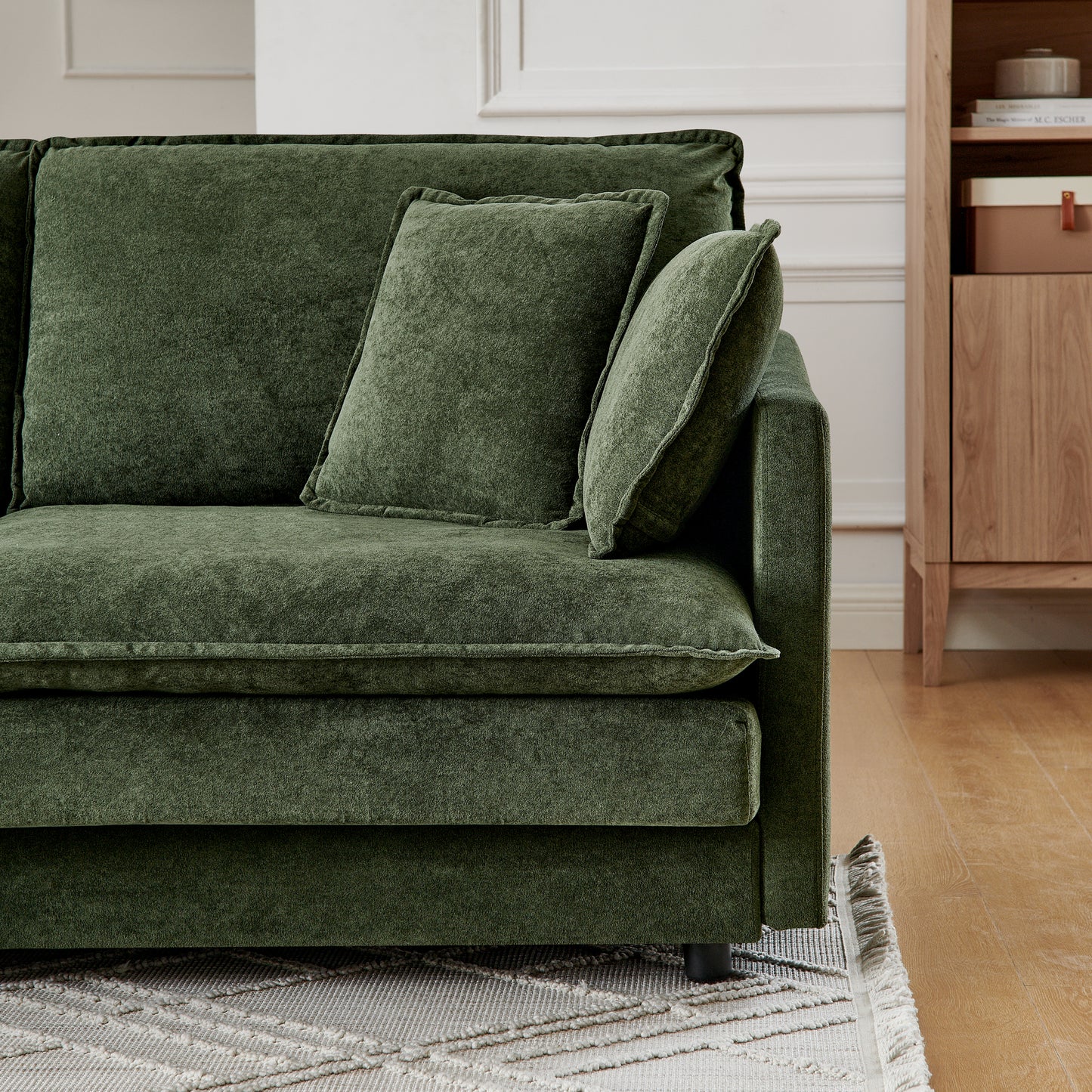 Deep green textured fabric sofa with plush cushions perfect for modern living room relaxation