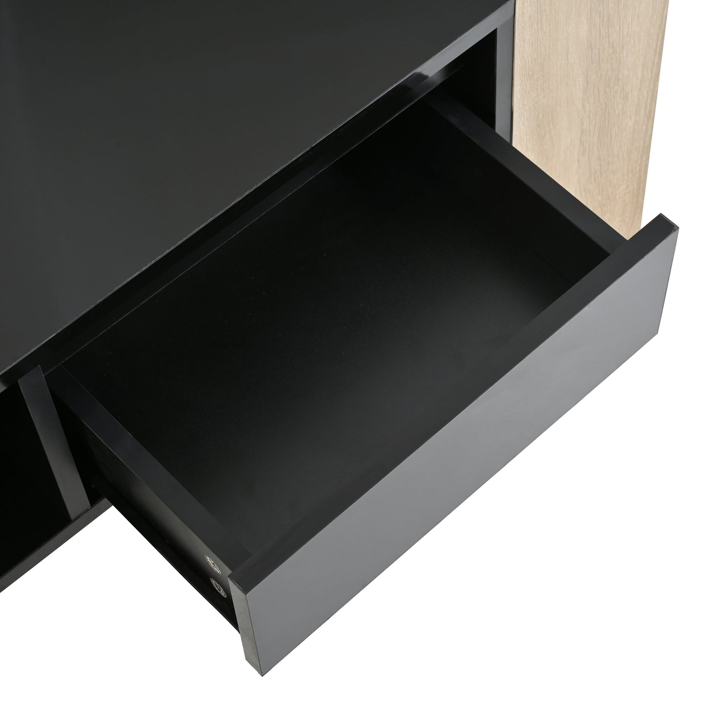 Black matte drawer front of a modern dresser with oak wood side panel