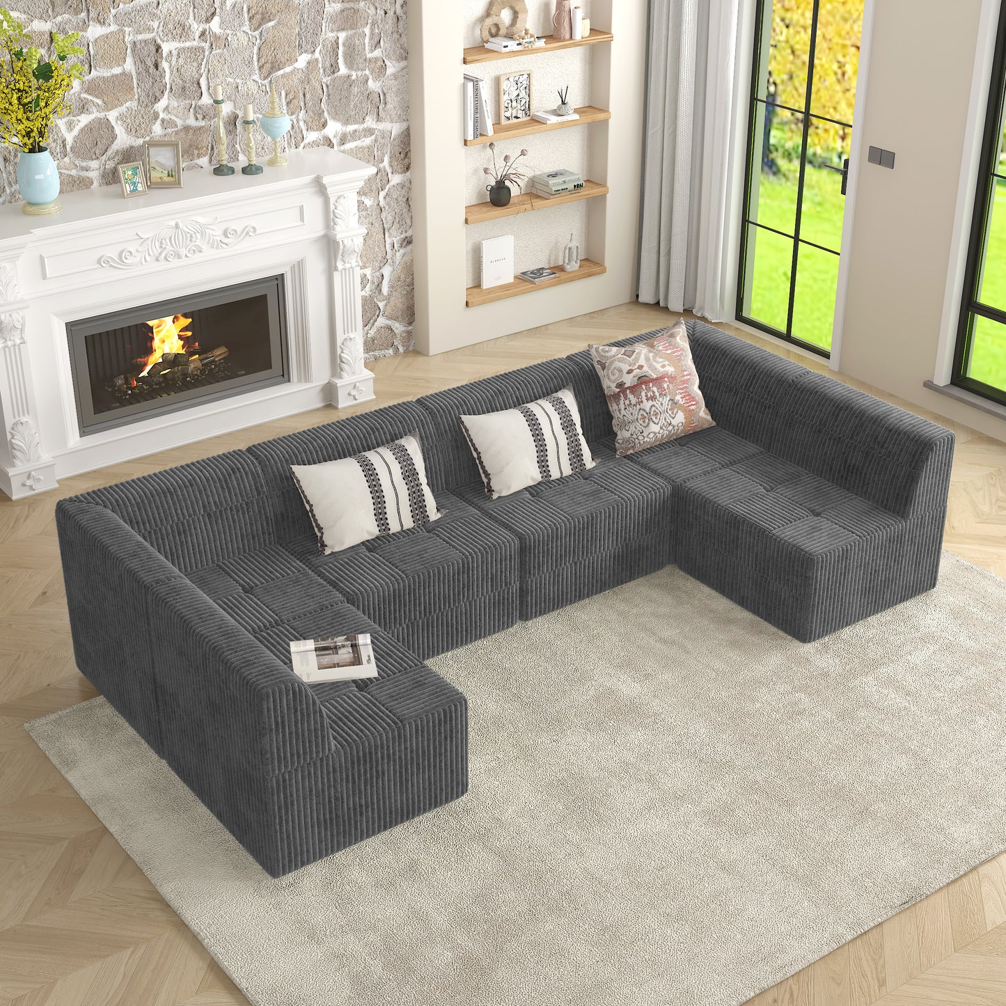 Dark gray corduroy Ushaped sectional sofa with tufted seat cushions and decorative pillows