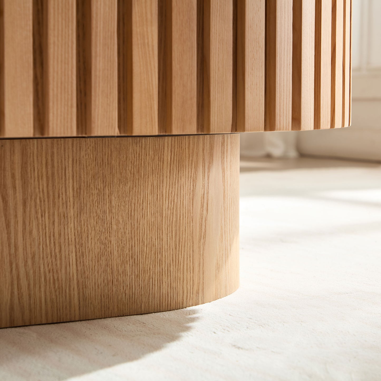 Closeup of natural oak wood grain on a fluted table base modern design