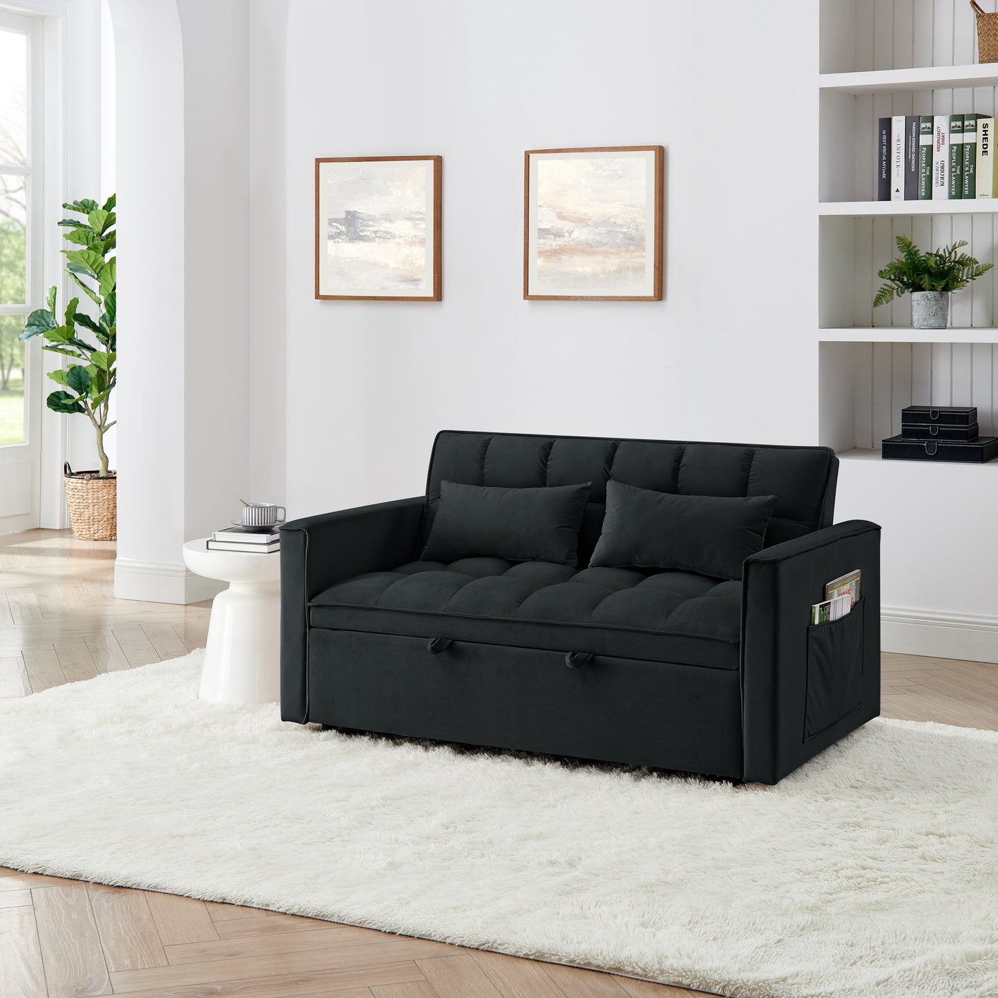 Dark gray tufted sofa bed with two pillows and side pocket storage