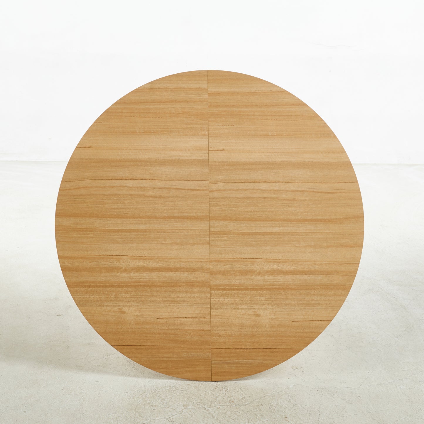 Round oak veneer tabletop with visible wood grain
