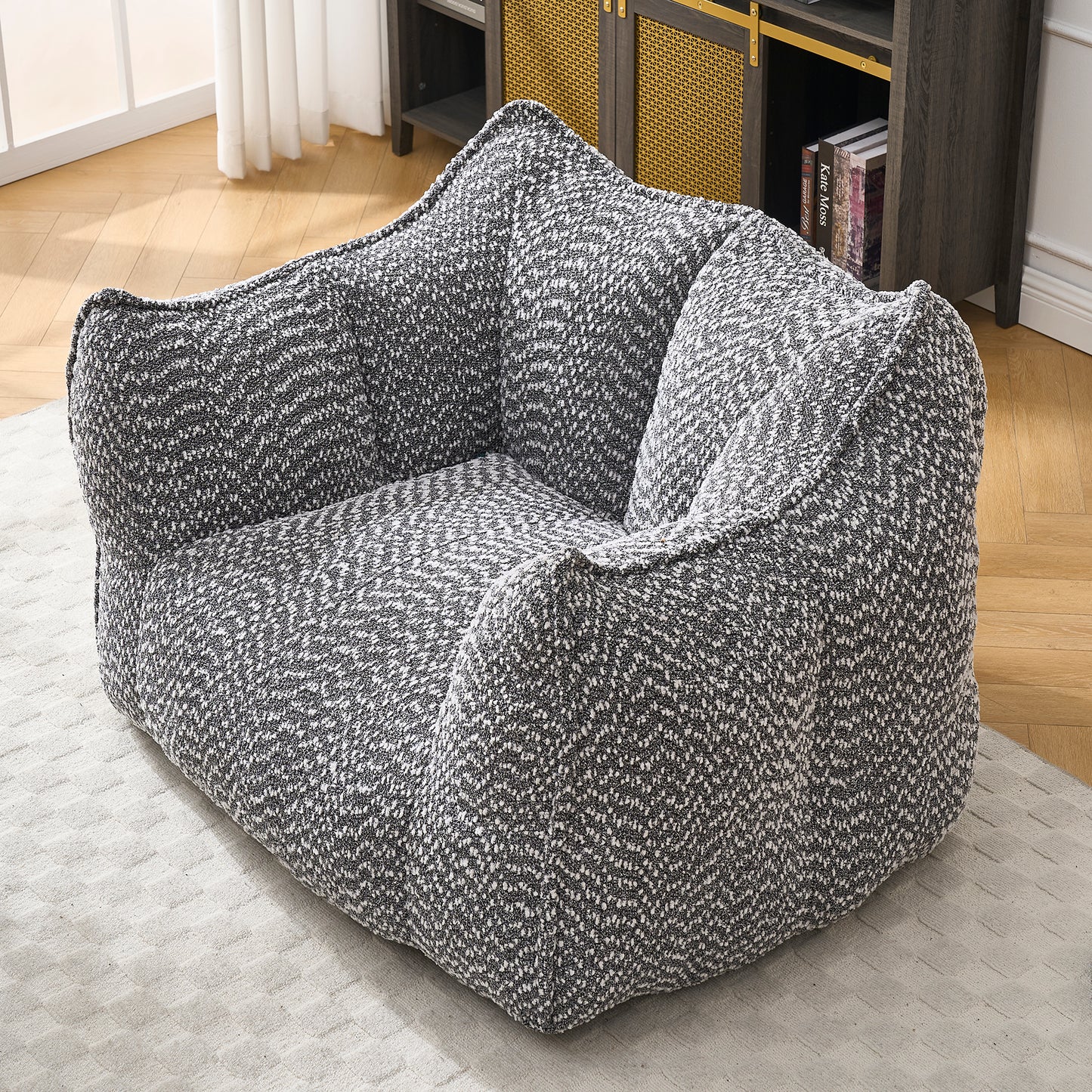 Cozy boucle bean bag chair in black and white speckled fabric perfect for lounging