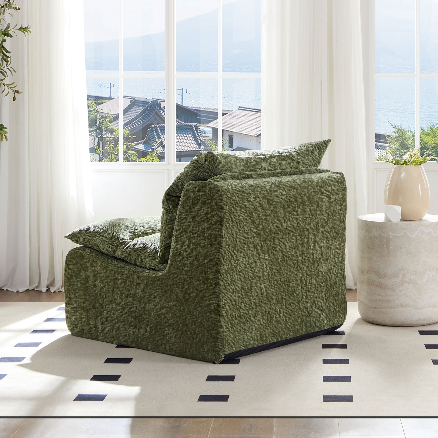 Plush green armchair with textured fabric and overstuffed cushions perfect for modern living rooms