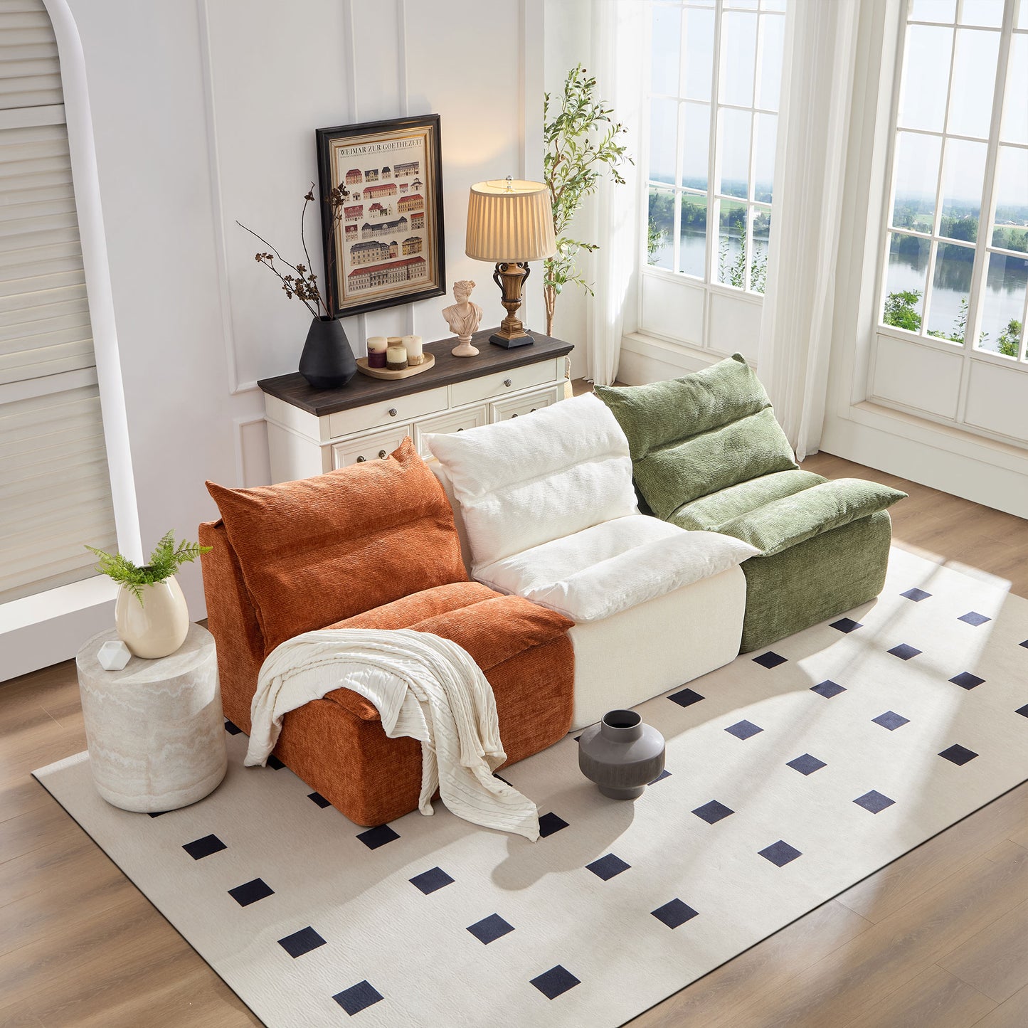 Plush orange modular sofa section with textured fabric and folded throw blanket
