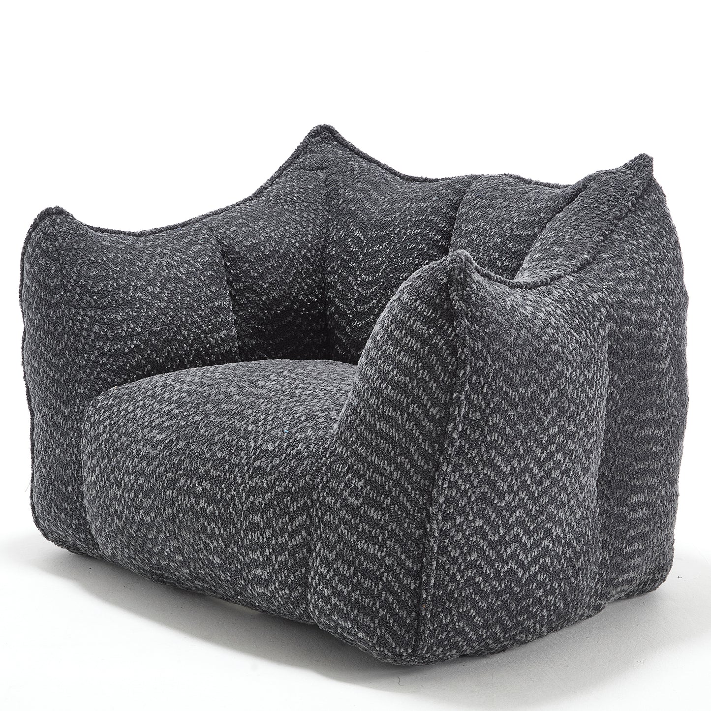 Textured grey armchair with plush cushioning and a modern lowprofile design