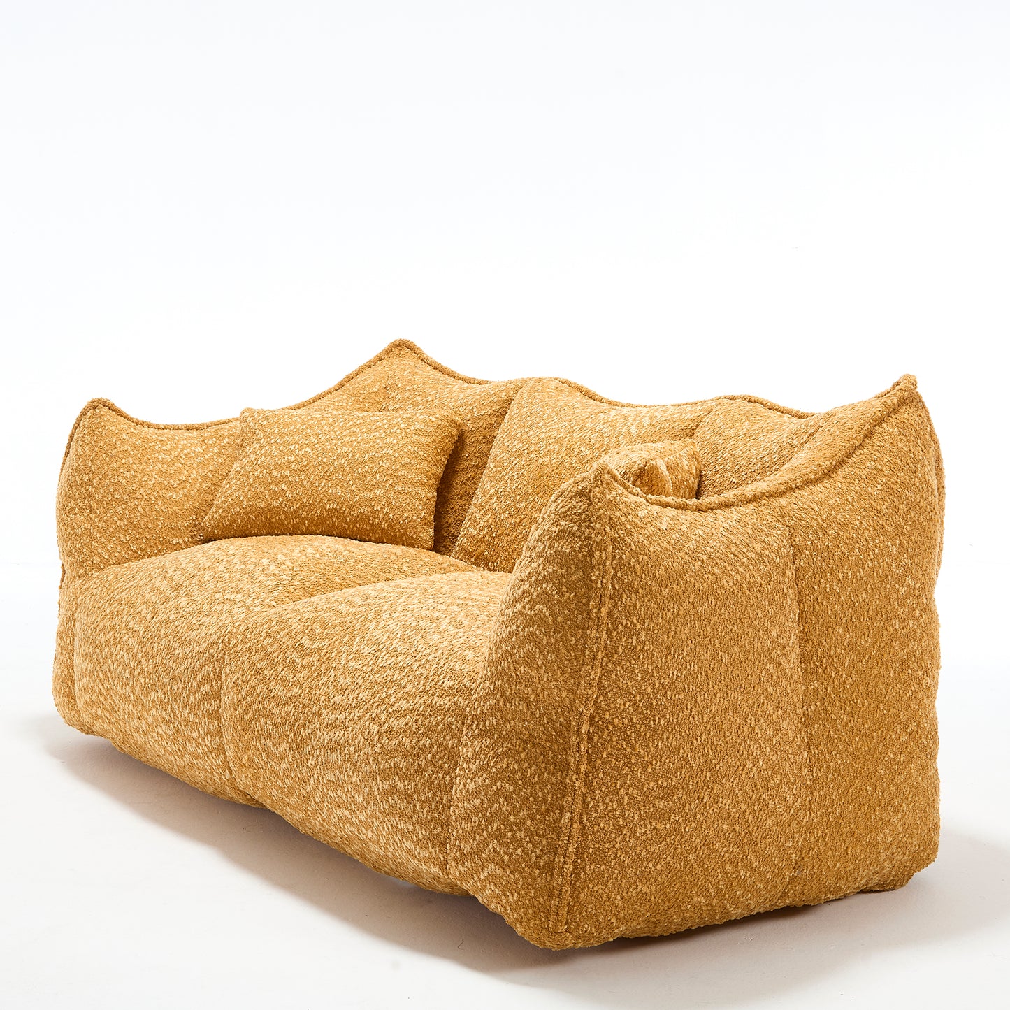 Plush mustard yellow boucle fabric sofa with deep seating and accent pillows