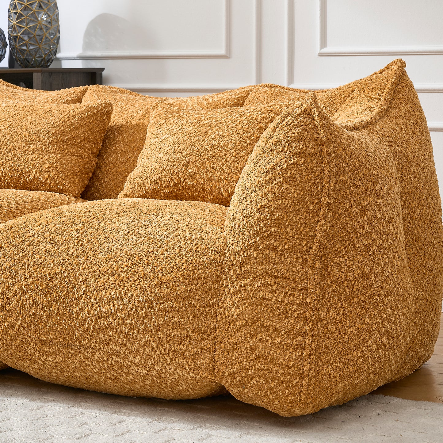 Cozy mustard yellow boucle fabric sofa with plush cushions for ultimate comfort