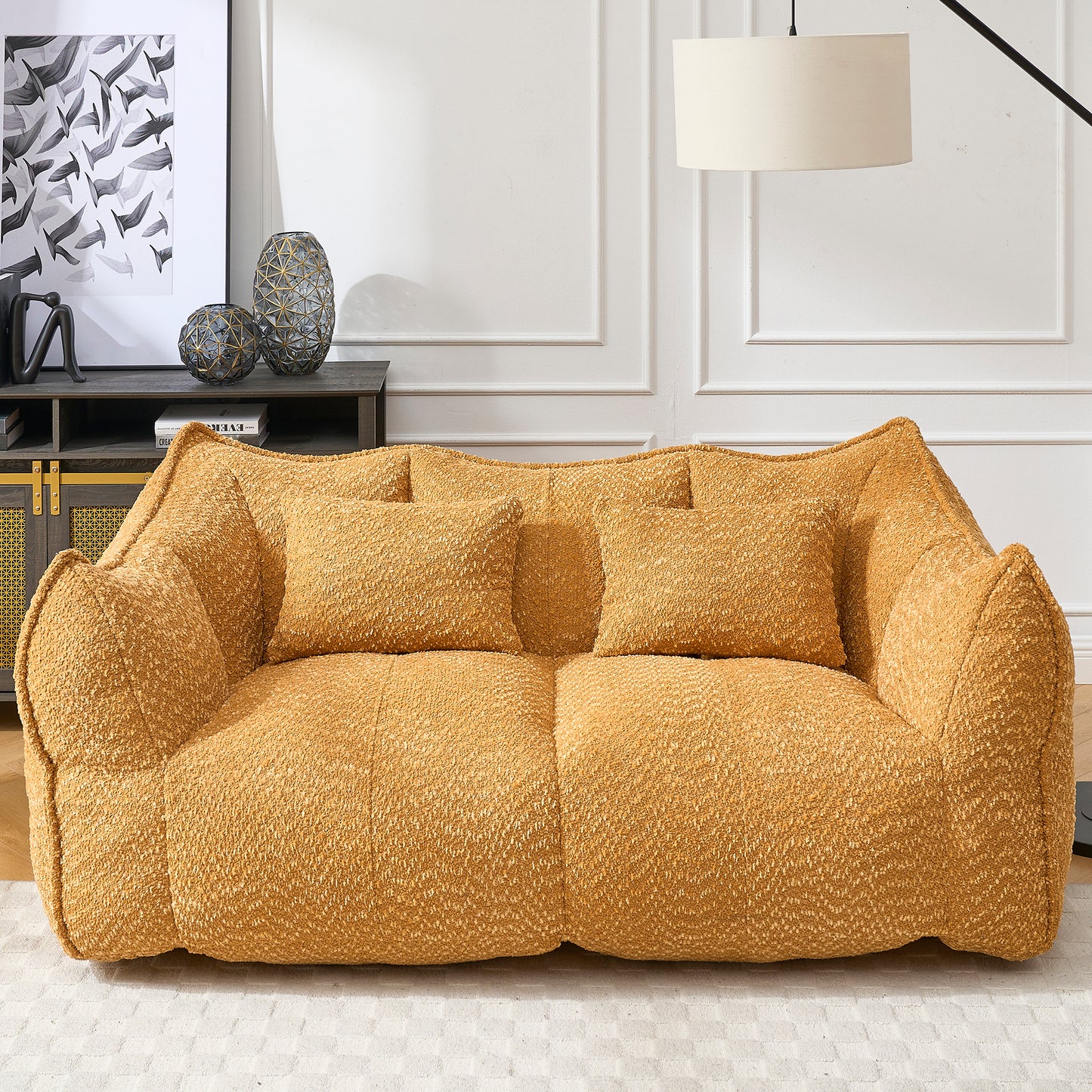 Cozy mustard yellow boucle fabric sofa with textured cushions and inviting design