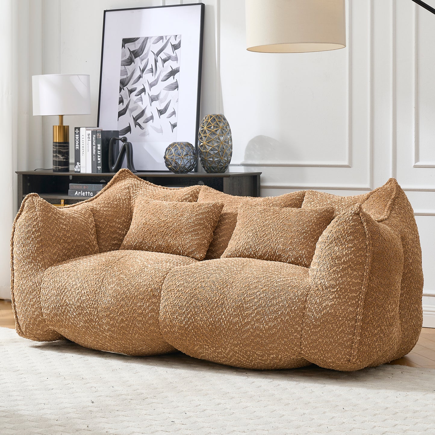 Textured boucle fabric sofa in a warm camel color featuring plush cushions and a modern organic design for living rooms