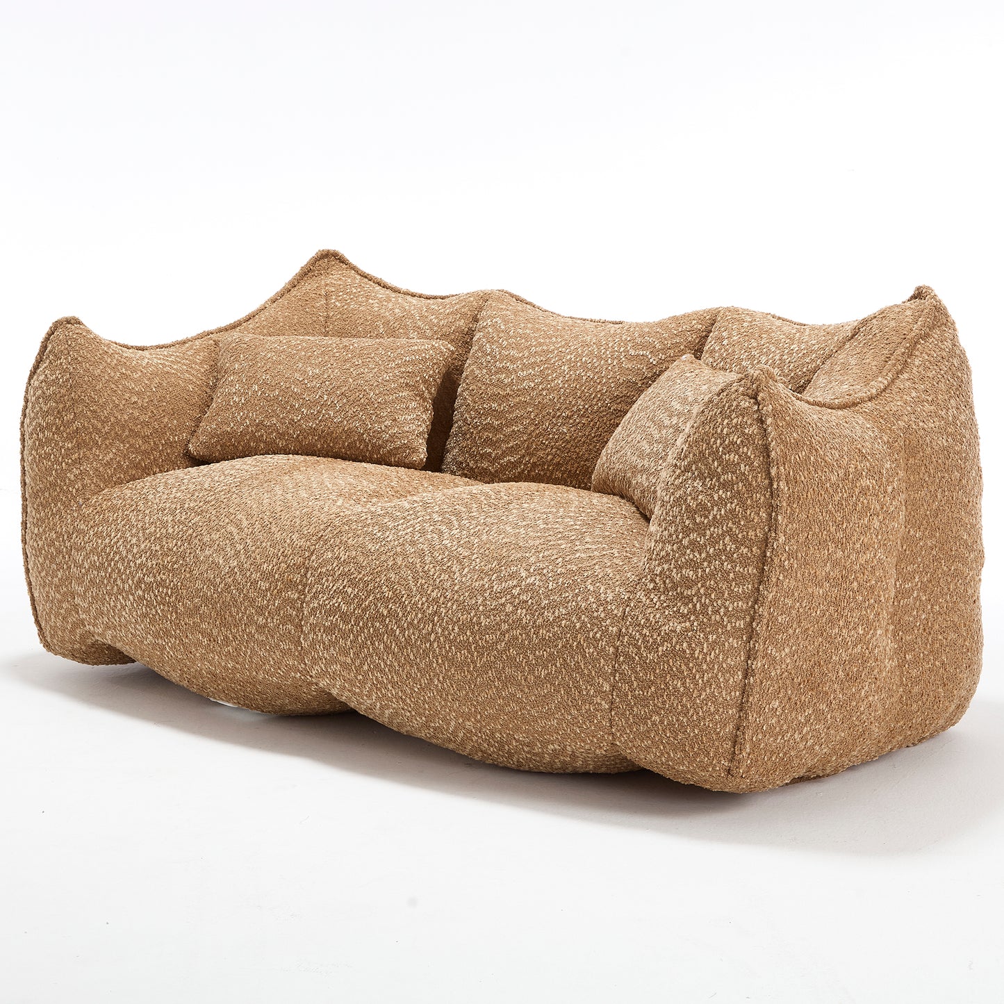 Textured brown sofa with organic curves and plush accent pillows